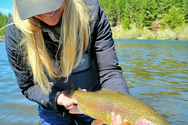 The ladies catching a nice little Truckee River rainbow trout on a full day guide trip