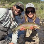 Expert guide teaching fly presentation on the Truckee River.