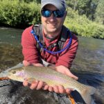 Fly fisherman wading the Truckee River.